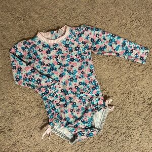 Ruffle Butts long sleeve one piece with ruffled bottoms